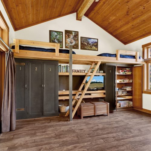 Game room with loft bunks, queen sleeper sofa and game closet