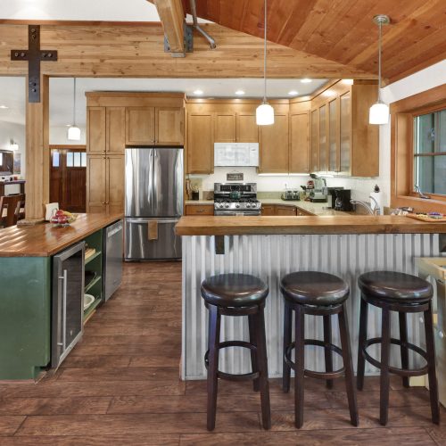 Kitchen with island and counter-height bar